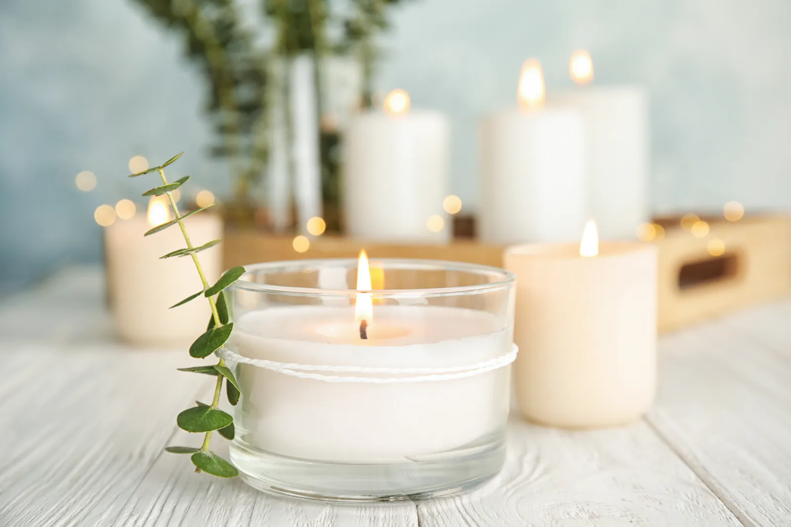 Softly lit candles setting a calm mood for a facial treatment